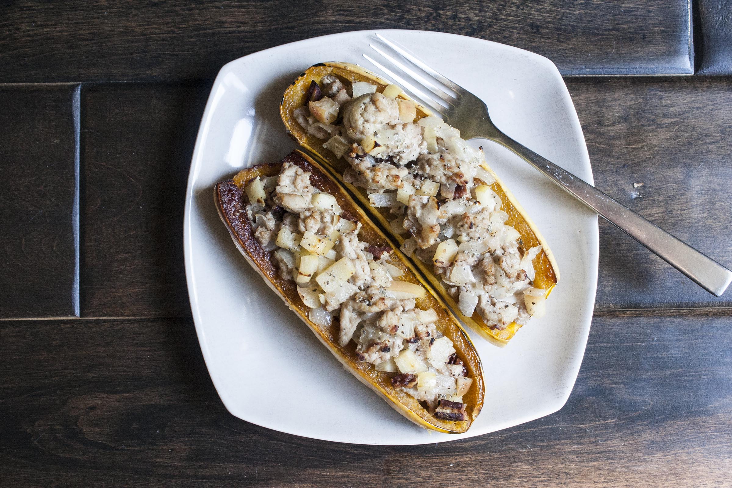 Delicata Squash is roasted until golden, and stuffed with a mixture of ground turkey, apples and pecans.