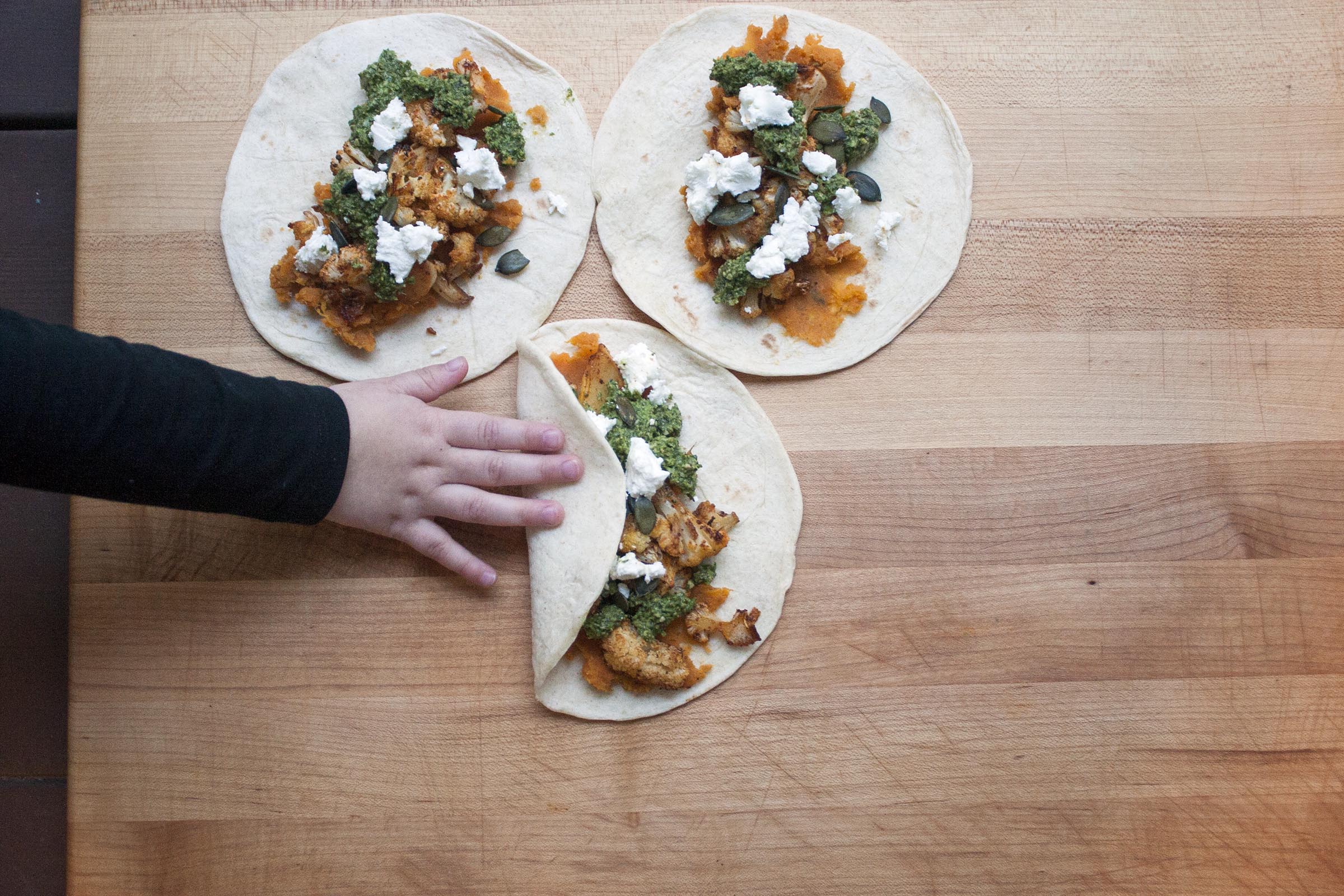 Smoked Paprika Roasted Cauliflower Tacos with Mashed Sweet Potatoes, Cilantro Sauce and Pumpkin Seeds. lifeaswecookit.com