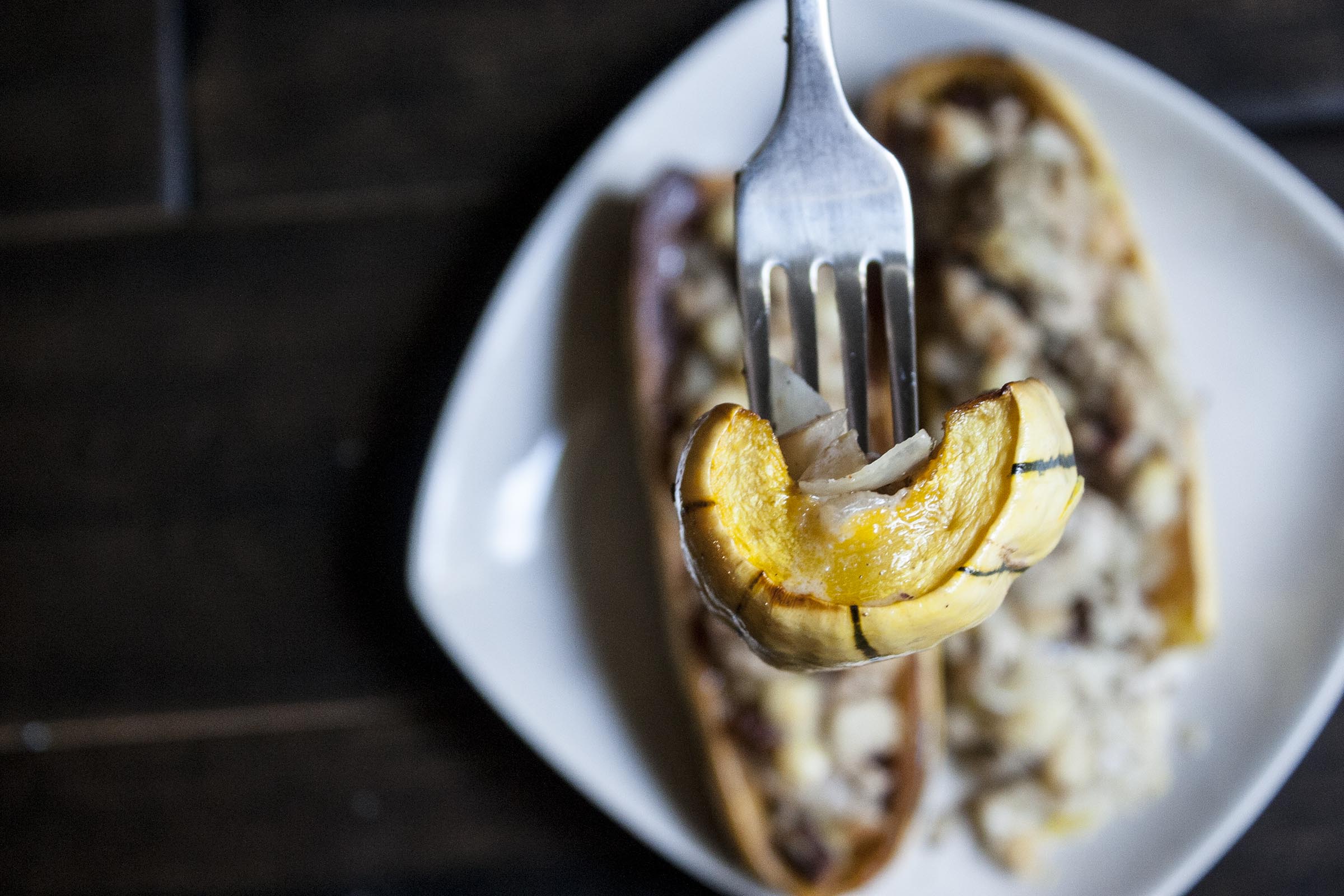 This is a slice of stuffed delicata squash.