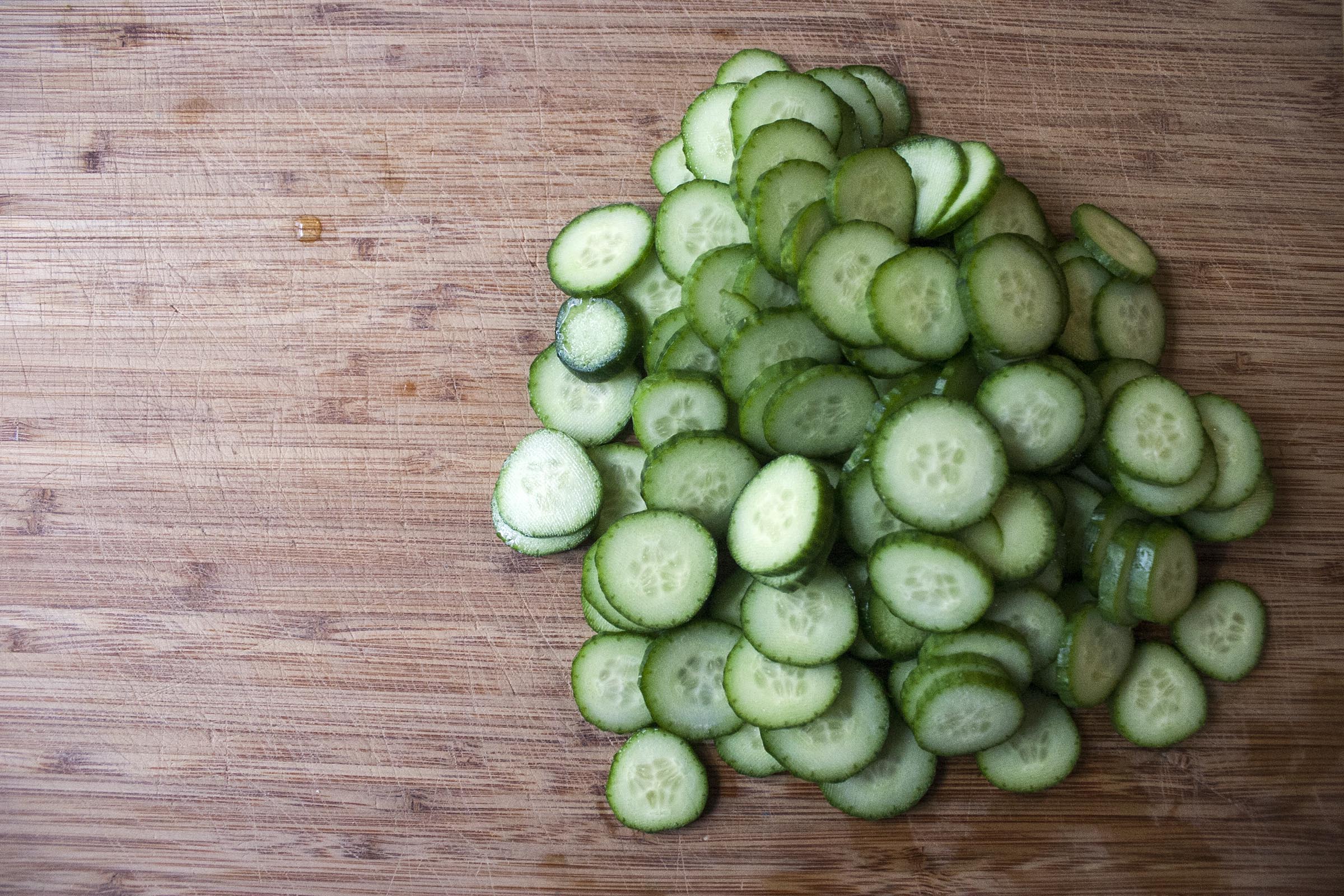 Cut cucumbers for rice vinegar pickles to go on Mushroom Steamed Buns. lifeaswecookit.com