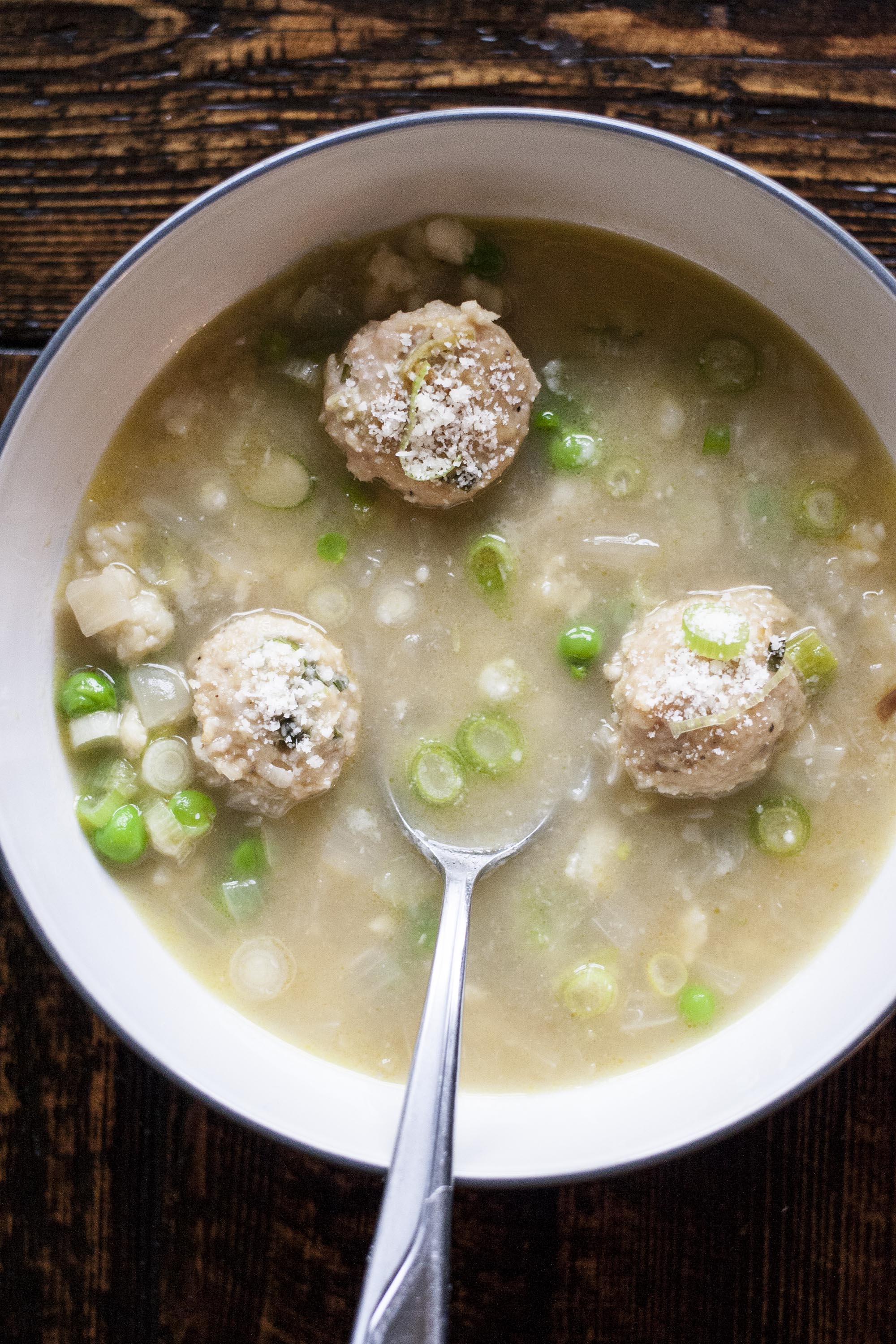 Grated Pasta, Lemon Chicken-Meatballs and Peas in Broth: Hand-grated, meatballs and peas to make the perfect, not too heavy, winter soup. lifeaswecookit.com