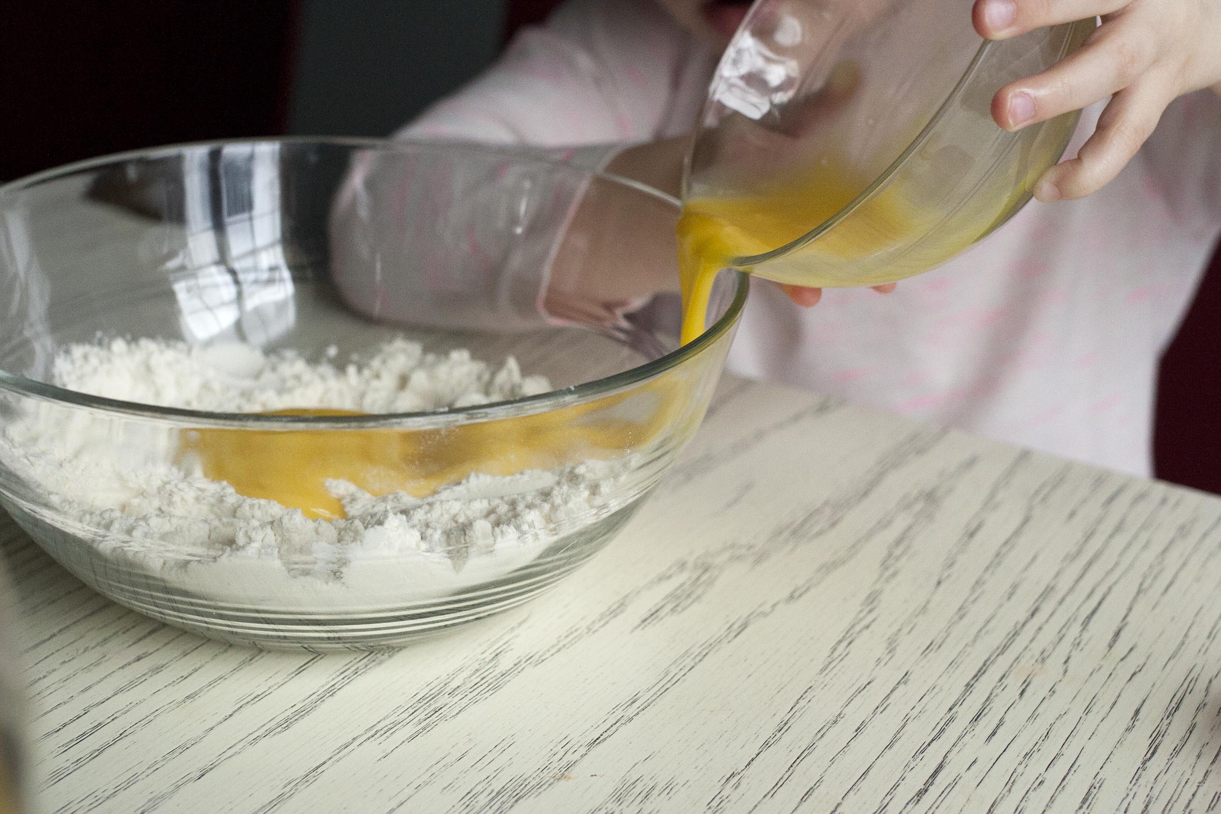 Adding egg to the flour and salt for grated pasta dough. lifeaswecookit.com