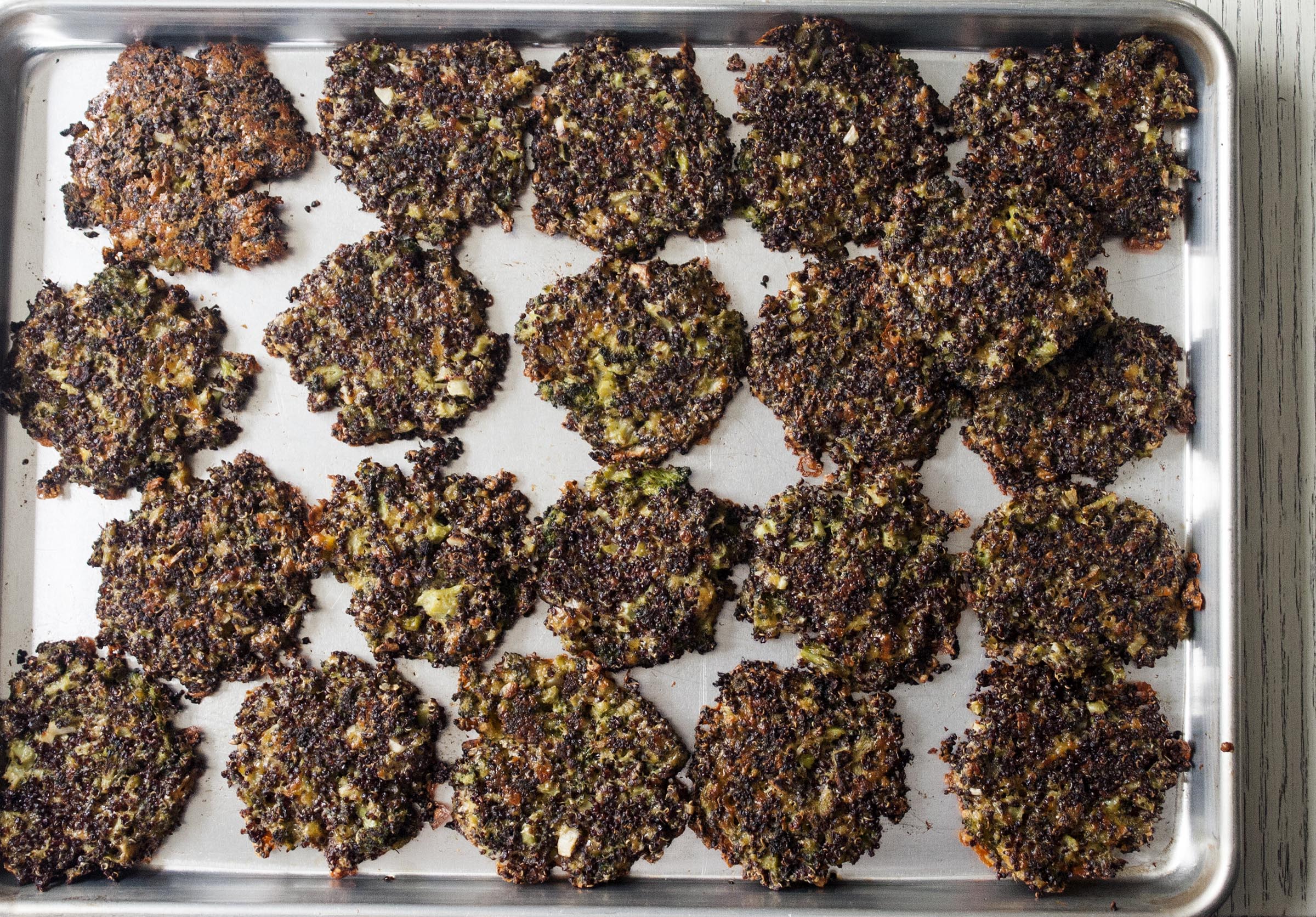 A big messy tray of Broccoli Quinoa Cheddar Cakes. www.lifeaswecookit.com