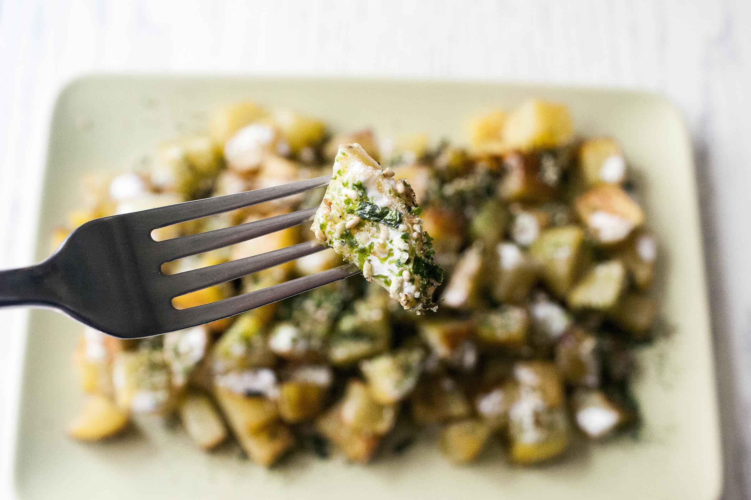 Roasted Furikake Roasted Potatoes on a fork. lifeaswecookit.com