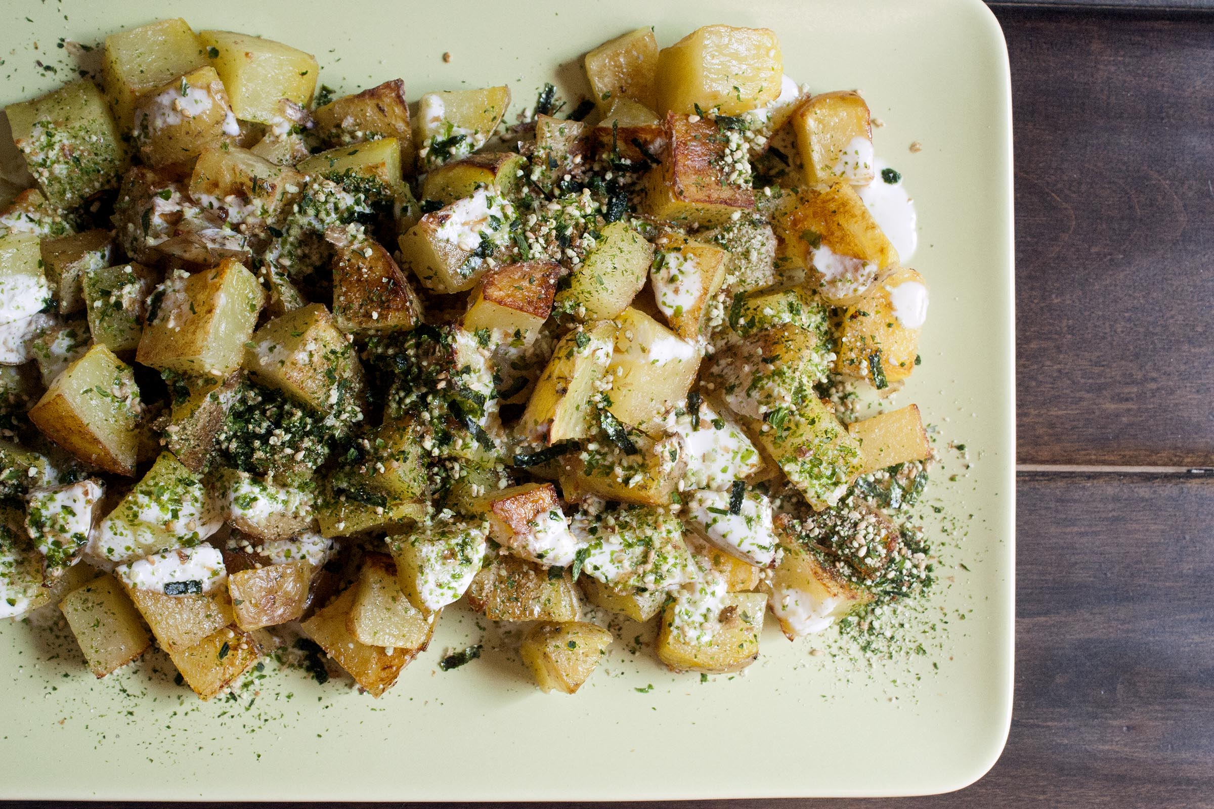 Yellow Potatoes are roasted until golden on the outside and creamy inside, then drizzled with lime yogurt and sprinkled with addictive furikake. lifeaswecookit.com