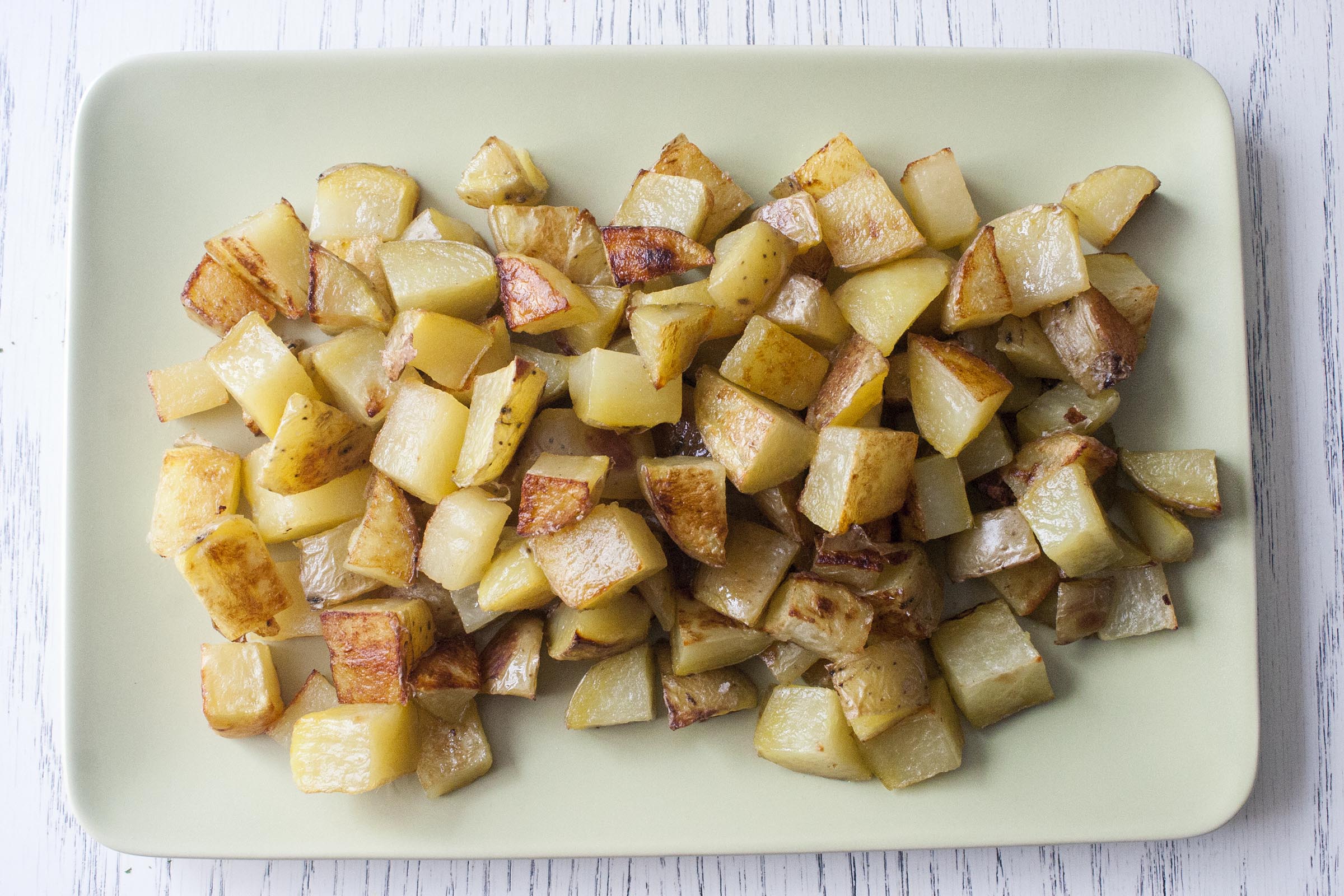 Roasted Potatoes about to be covered with lime yogurt and furikake. lifeaswecookit.com