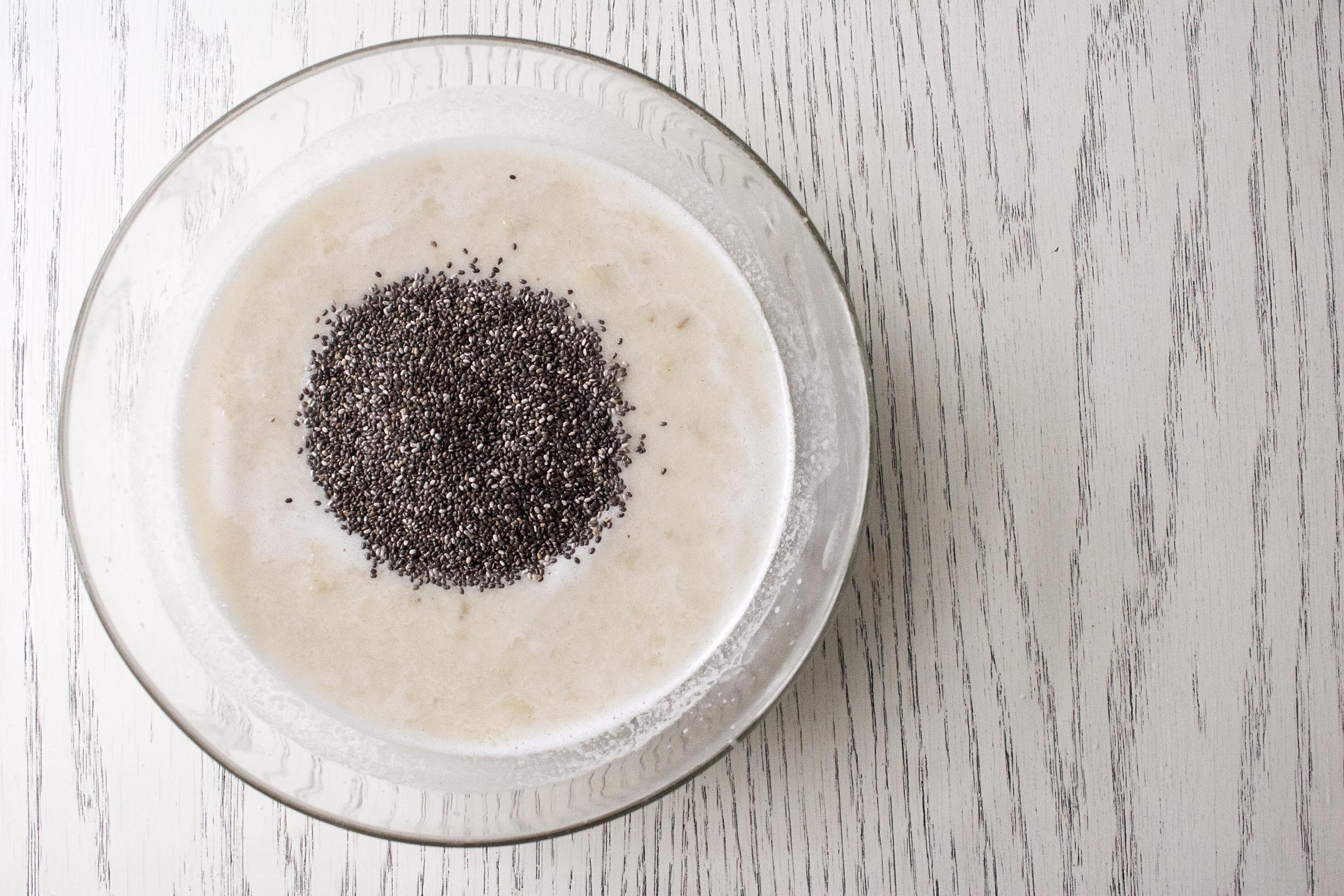 Chia Seeds about to mixed into Homemade Coconut Milk and Bananas for Banana Cardamom Chia Pudding. www.lifeaswecookit.com