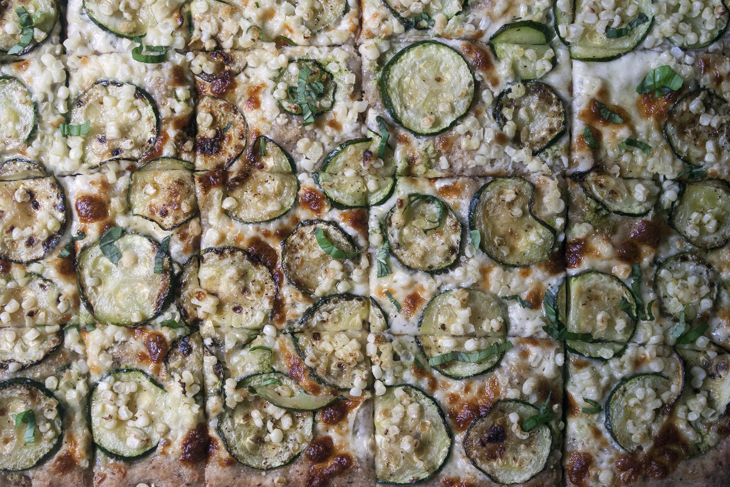 Baked Whole Wheat Millet and Flaxseed Pizza with Garlic Scape Pesto, Zucchini and Corn. www.lifeaswecookit.com