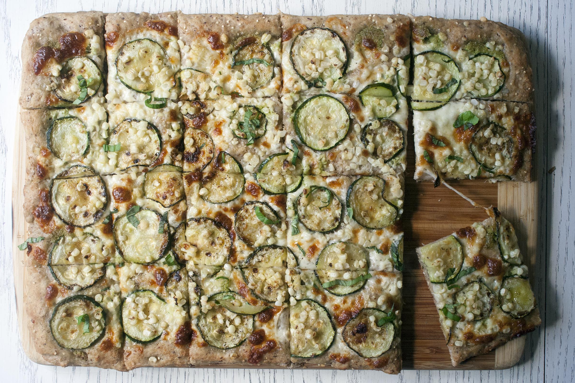 Baked Whole Wheat Millet and Flaxseed Pizza with Garlic Scape Pesto, Zucchini and Corn. www.lifeaswecookit.com