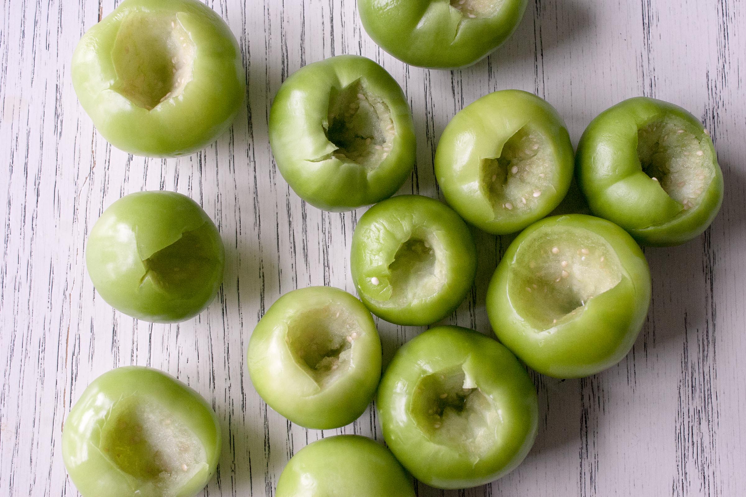 Husked, Rinsed and Cored Tomatillos for Fresh Tomatillo & Avocado Salsa. www.lifeaswecookit.com 