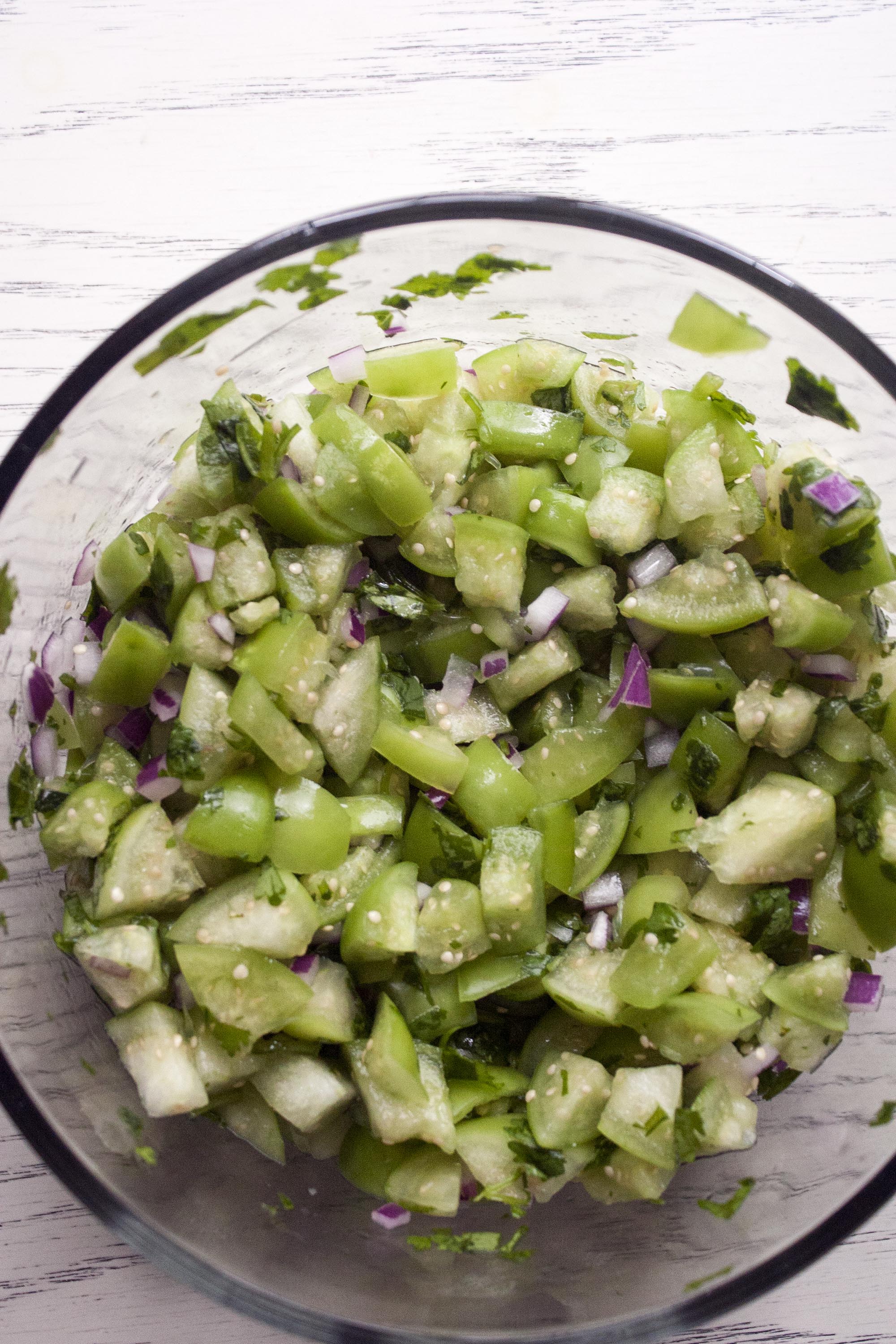 Everything stirred together for Fresh Tomatillo & Avocado Salsa. www.lifeaswecookit.com