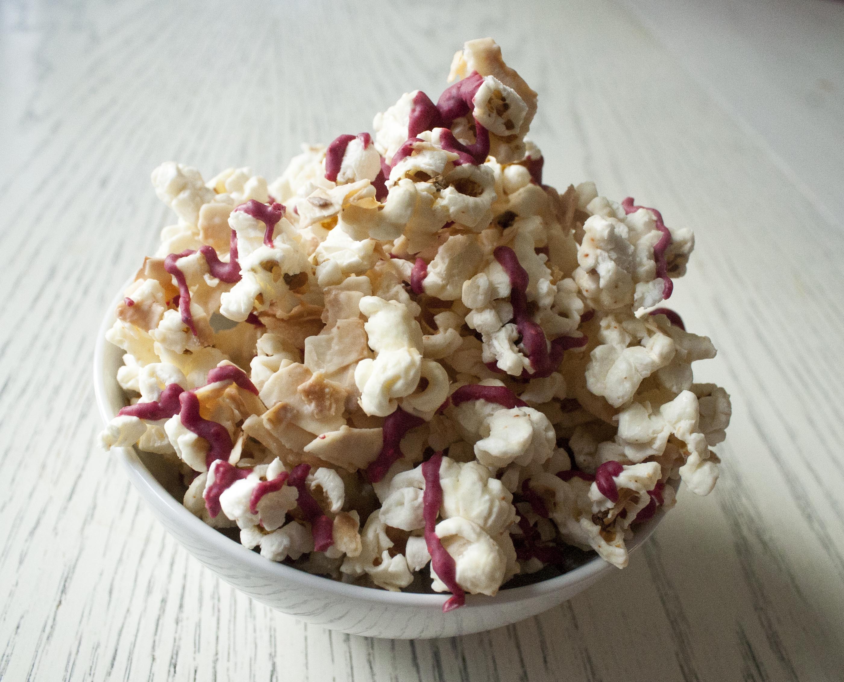 Coconut and Raspberry-Drizzled White Chocolate Popcorn www.lifeaswecookit.com