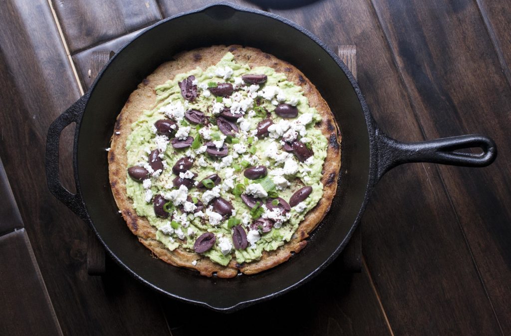 Scallion & Sumac Socca with Mashed Avocado, Olives and Feta