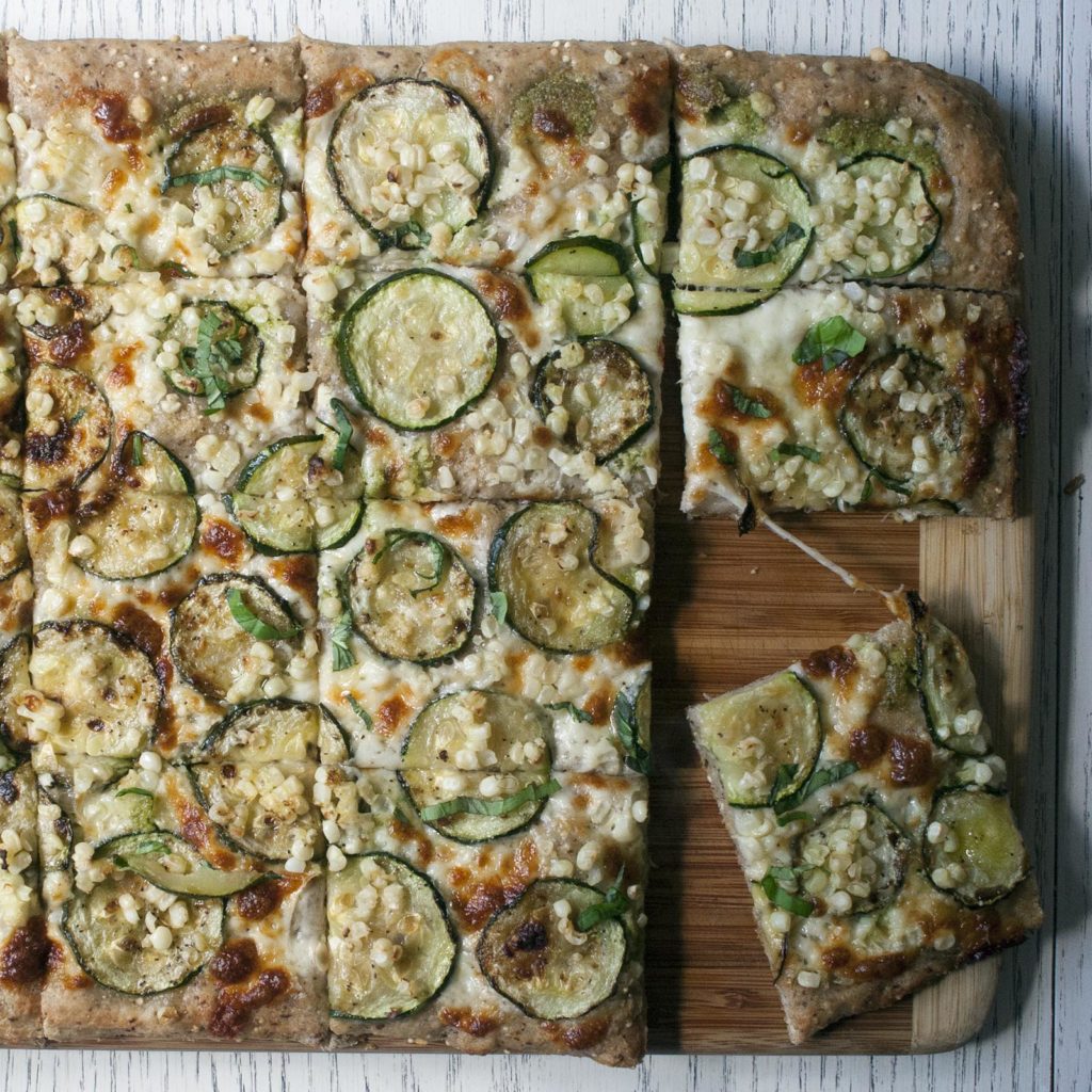 Seeded Whole Wheat Pizza with Garlic Scape Pesto, Zucchini & Corn